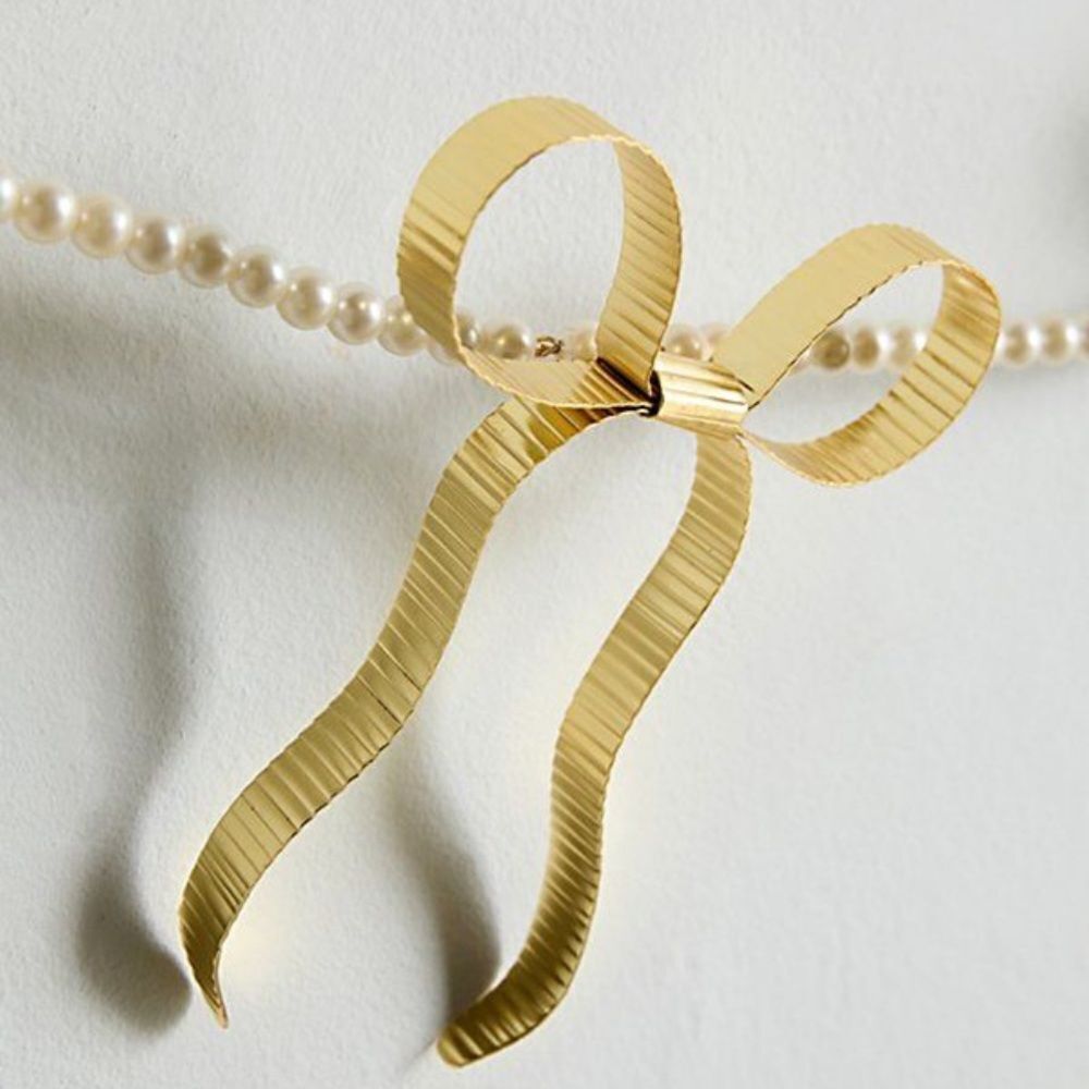 Eloise Pearl & Bow Banner from Urban Outfitters Outfit Your Dorm Back to School
